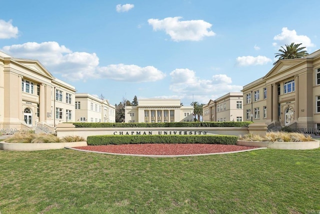 view of home's community with a lawn