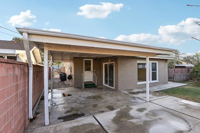 rear view of house featuring a patio