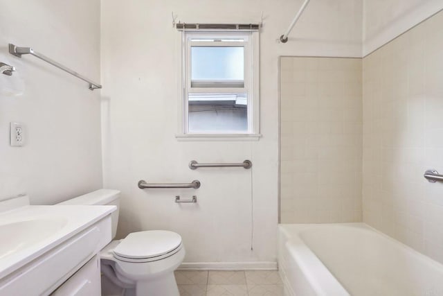 full bathroom featuring tiled shower / bath, vanity, and toilet