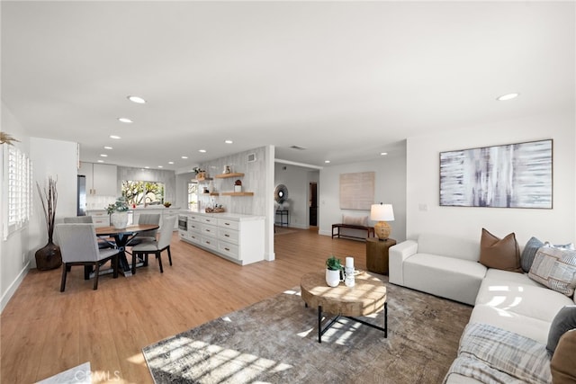 living room with light hardwood / wood-style floors