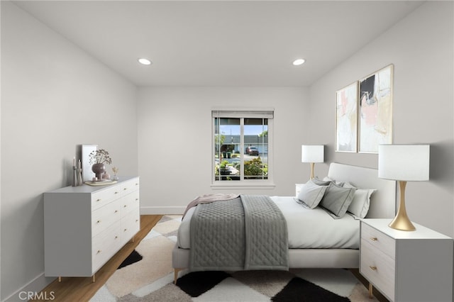 bedroom with light hardwood / wood-style flooring