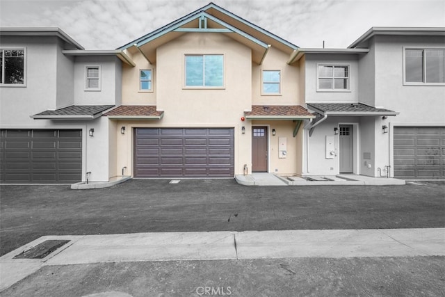 townhome / multi-family property featuring a garage