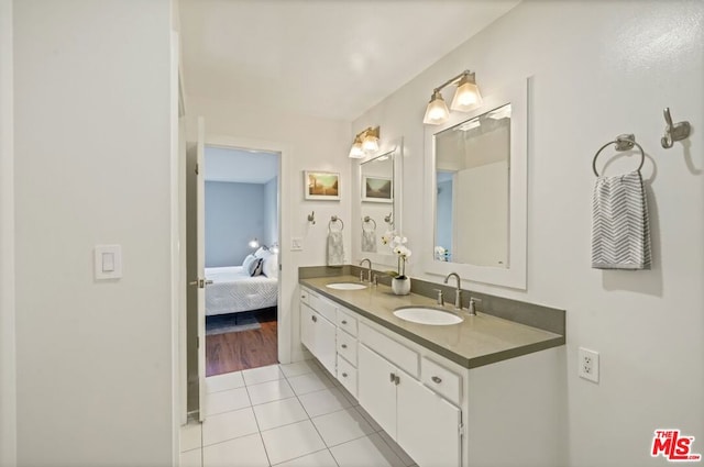 bathroom with vanity and tile patterned flooring