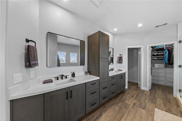 bathroom featuring vanity and hardwood / wood-style flooring