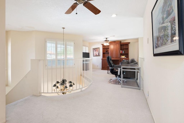 office space with light colored carpet and an inviting chandelier