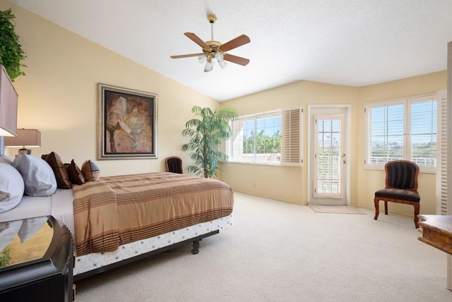 bedroom featuring light colored carpet, ceiling fan, and vaulted ceiling