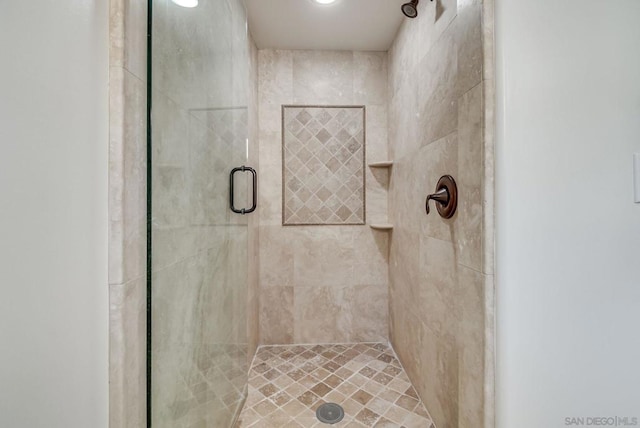 bathroom featuring an enclosed shower