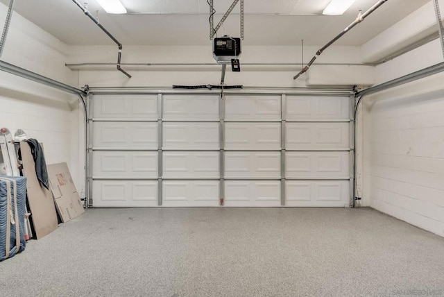 garage featuring a garage door opener