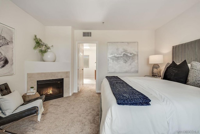 bedroom featuring light carpet