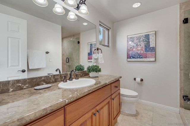 bathroom featuring vanity, toilet, an enclosed shower, and tile patterned flooring