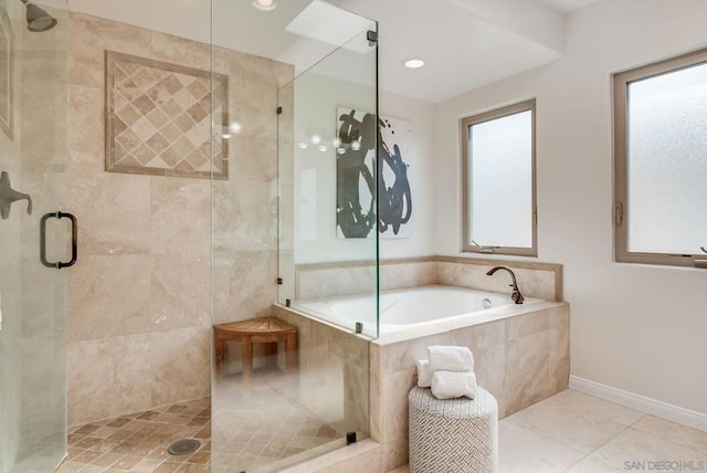 bathroom featuring tile patterned floors and shower with separate bathtub