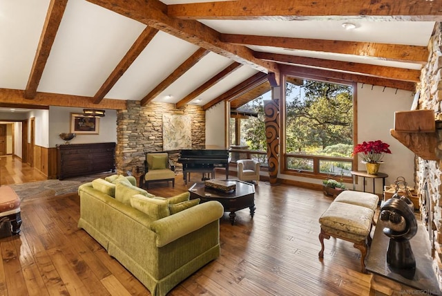 living room featuring hardwood / wood-style floors and lofted ceiling with beams