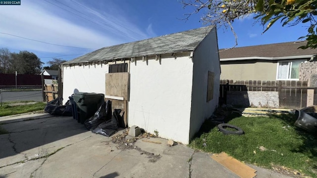 view of side of home with a patio