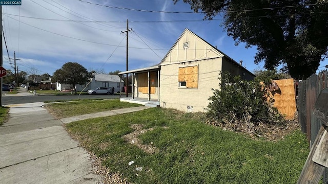 view of home's exterior with a yard