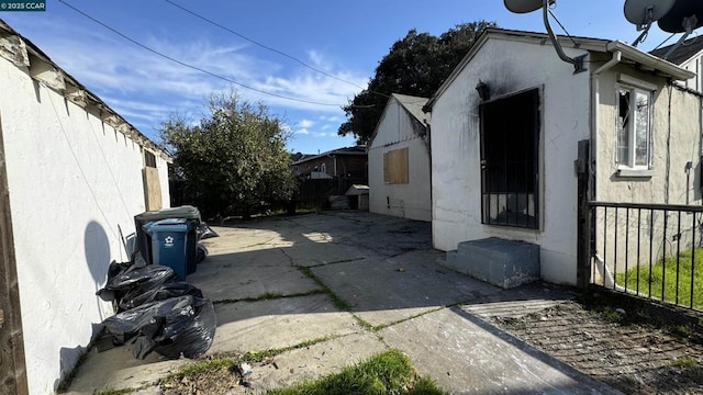 view of side of property featuring a patio