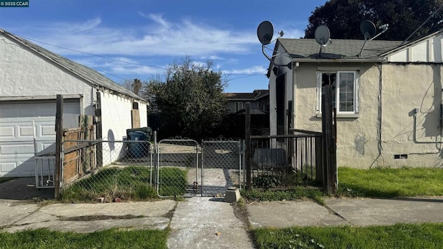 view of side of home featuring a garage