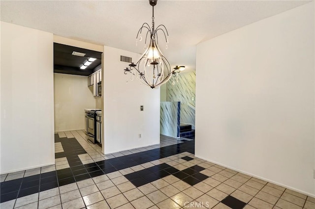 unfurnished dining area featuring tile patterned flooring and a notable chandelier