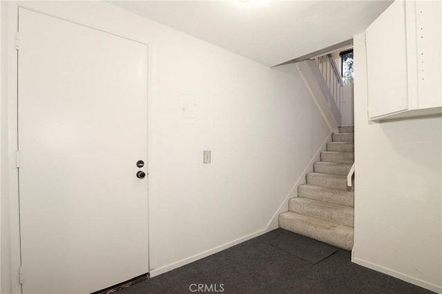 staircase with carpet flooring and baseboards