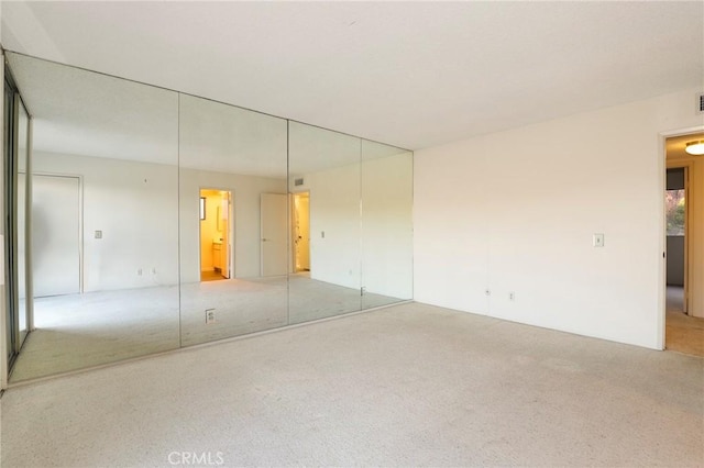 unfurnished room with carpet floors