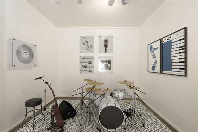 recreation room featuring baseboards and carpet floors