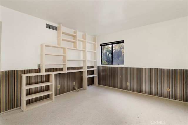 unfurnished living room featuring carpet floors