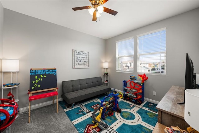 playroom with ceiling fan and carpet flooring