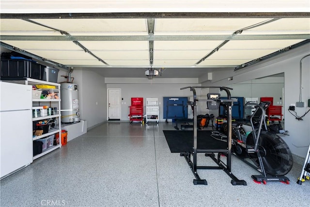 garage with white refrigerator, gas water heater, and a garage door opener