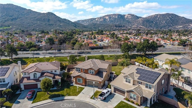 birds eye view of property with a mountain view