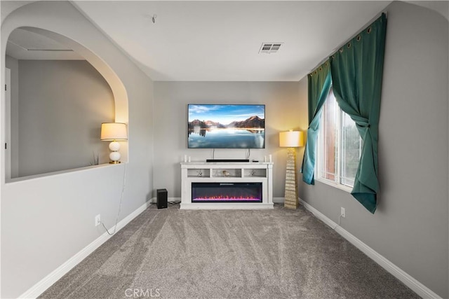 unfurnished living room with carpet flooring