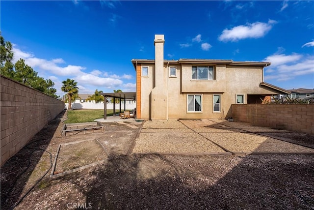 rear view of property with a patio area