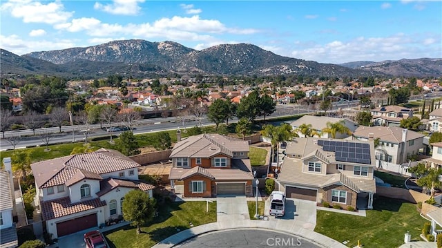 birds eye view of property featuring a mountain view