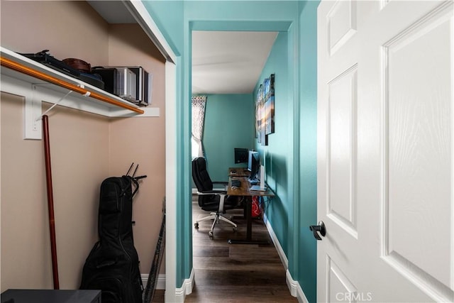 office with dark hardwood / wood-style flooring