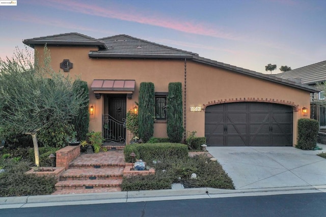 view of front of property with a garage