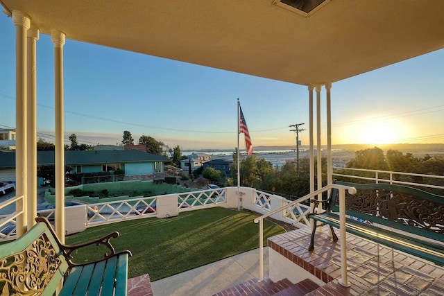 patio terrace at dusk with a lawn