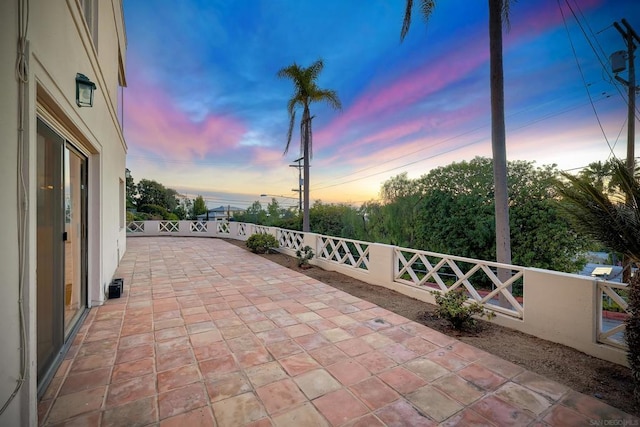 view of patio terrace at dusk