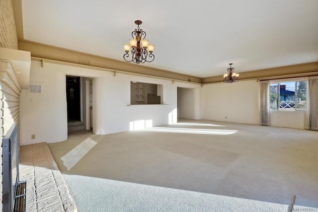 living room with light carpet, a notable chandelier, and a brick fireplace