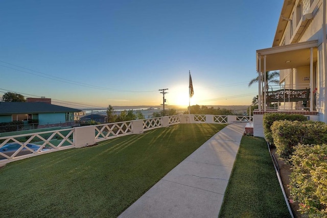 view of yard at dusk