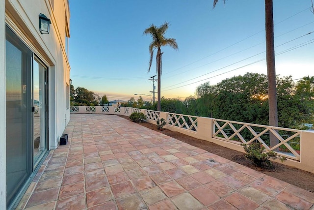 view of patio terrace at dusk