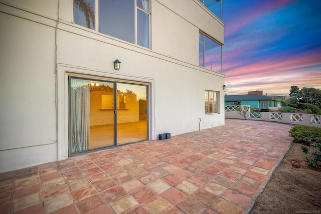 view of patio terrace at dusk