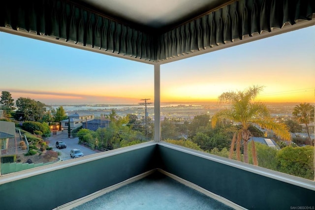 view of balcony at dusk