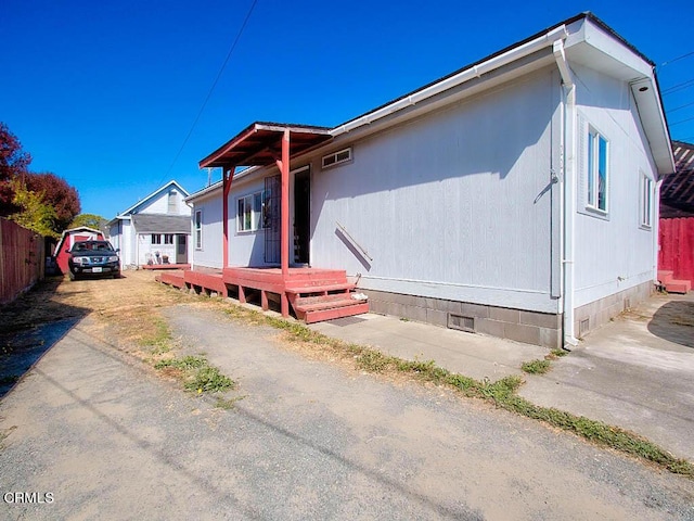 view of side of property featuring a garage