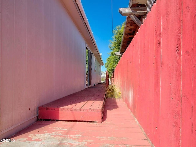 view of side of home featuring a deck