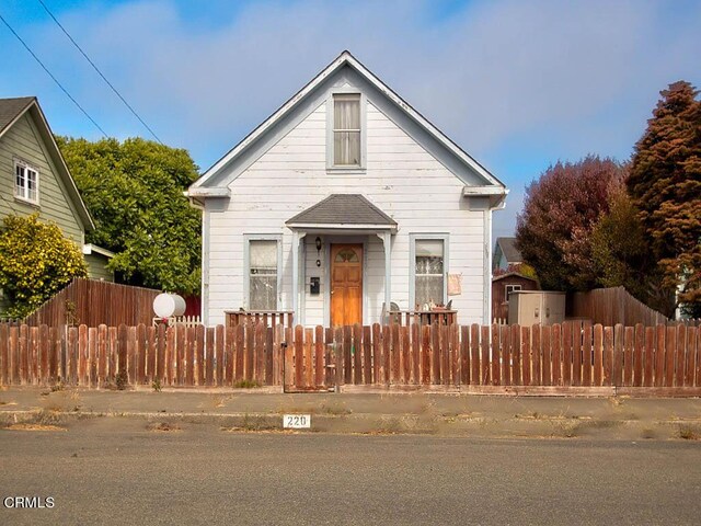 bungalow with a fenced front yard
