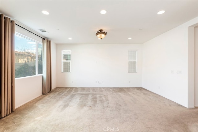 empty room with light colored carpet