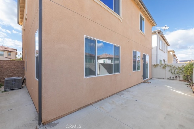 view of property exterior featuring a patio and central air condition unit