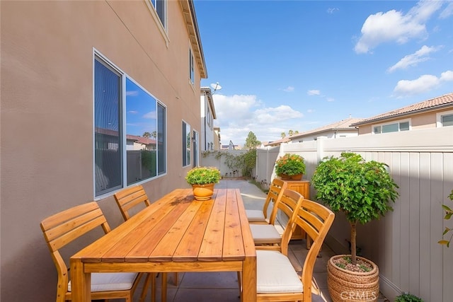 view of patio / terrace featuring outdoor dining space and fence