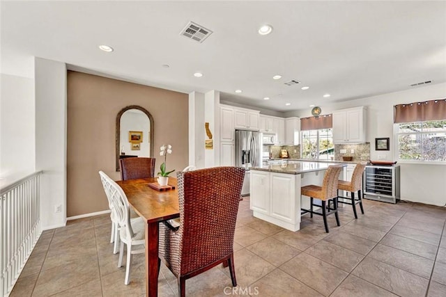 tiled dining room with beverage cooler