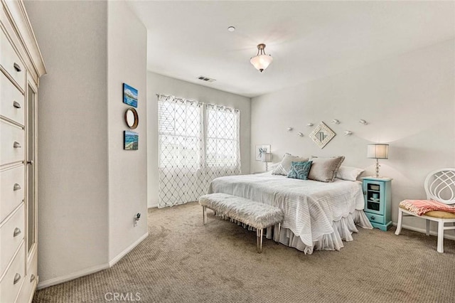 bedroom with light colored carpet