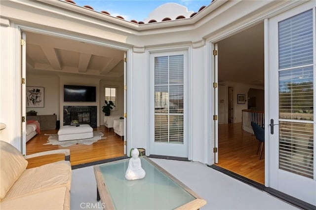 living room featuring exterior fireplace