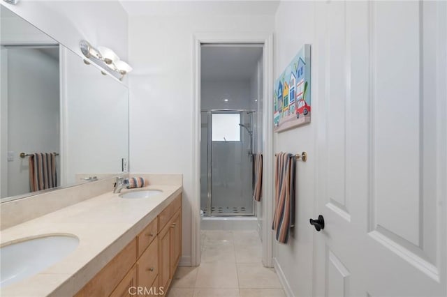 bathroom featuring vanity, an enclosed shower, and tile patterned flooring